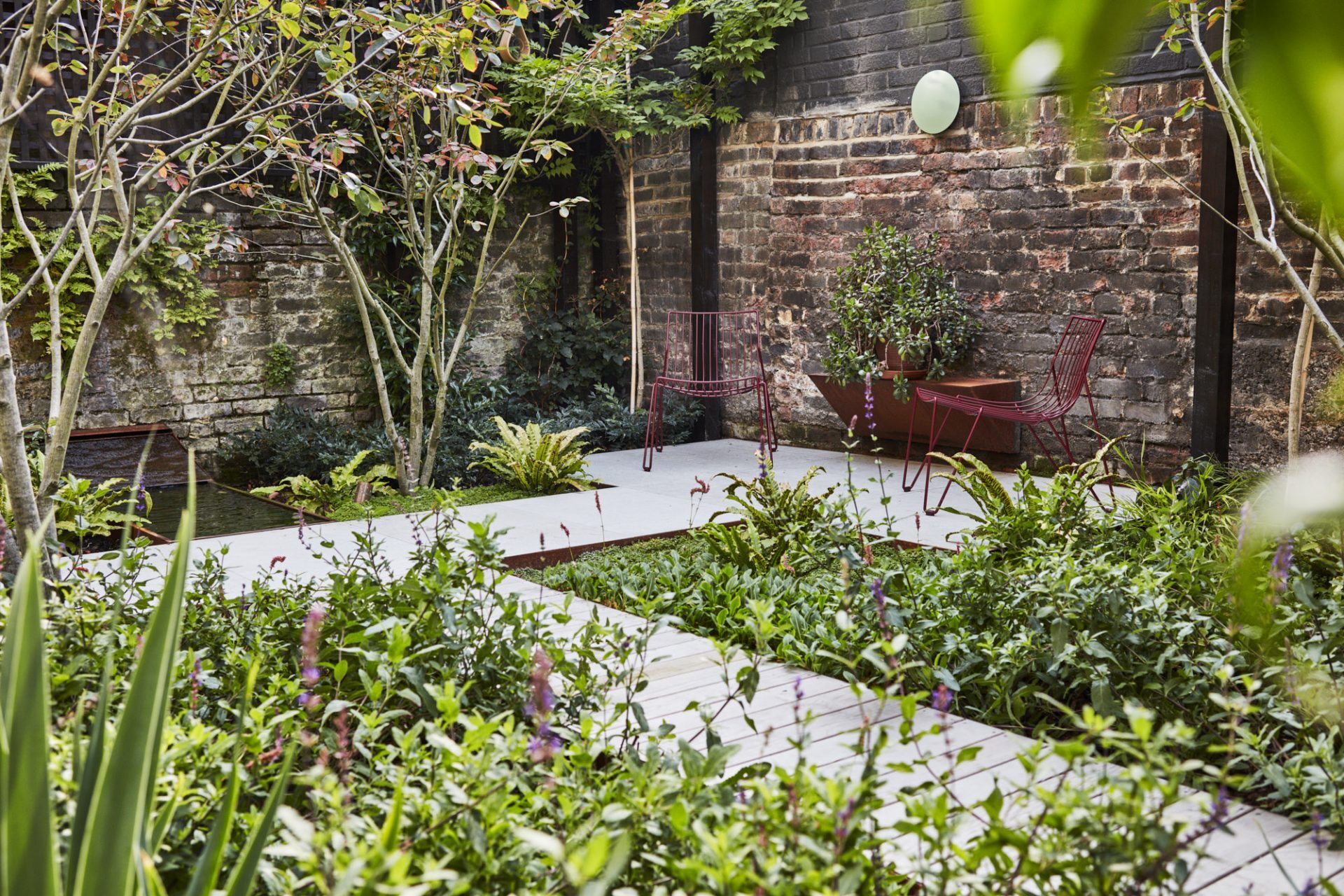 Outside seating and water feature - gardening summer tips